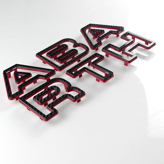 Scritta Abarth per mascherone paraurti originale in VERO CARBONIO per Abarth 595 - 695 - Restyling